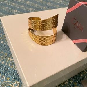 CAbi brass colored cuff. Adjustable. Approx 3” diameter
